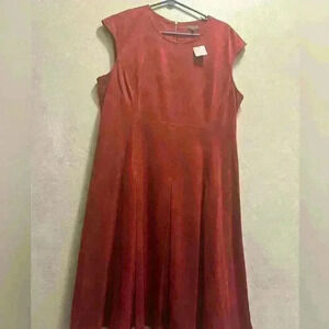 The limited collection- Orange faux leather/ suede dress. Pleated skirt